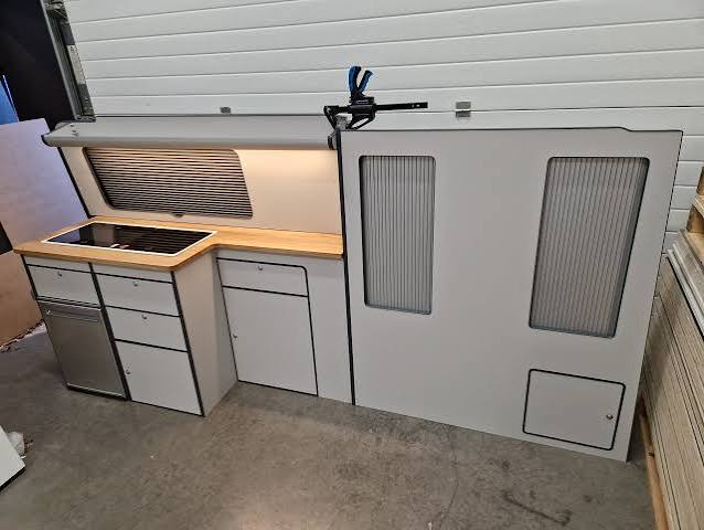 Slimline campervan kitchen unit with hob, timber worktop, drawers and matching side panel