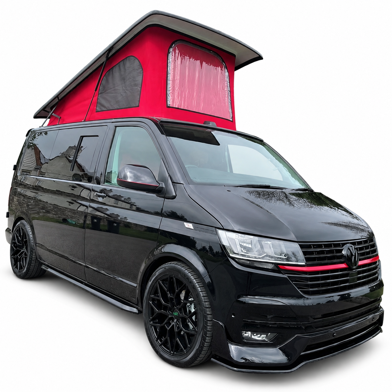 Black VW Transporter campervan with a red-canvas pop-top roof raised and black alloy wheels